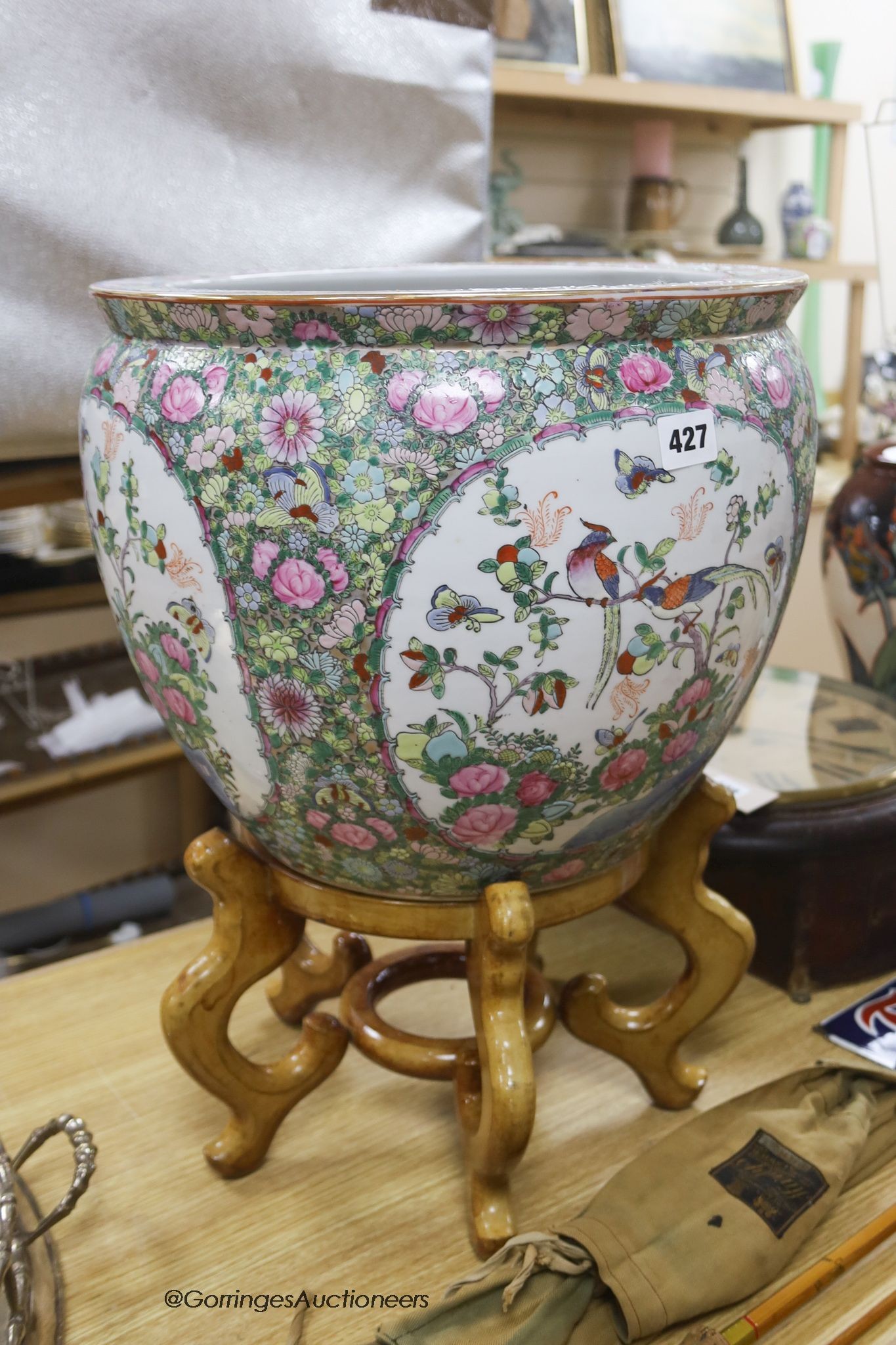 A modern Cantonese export famille rose fish bowl, on hardwood stand, overall height 51cm